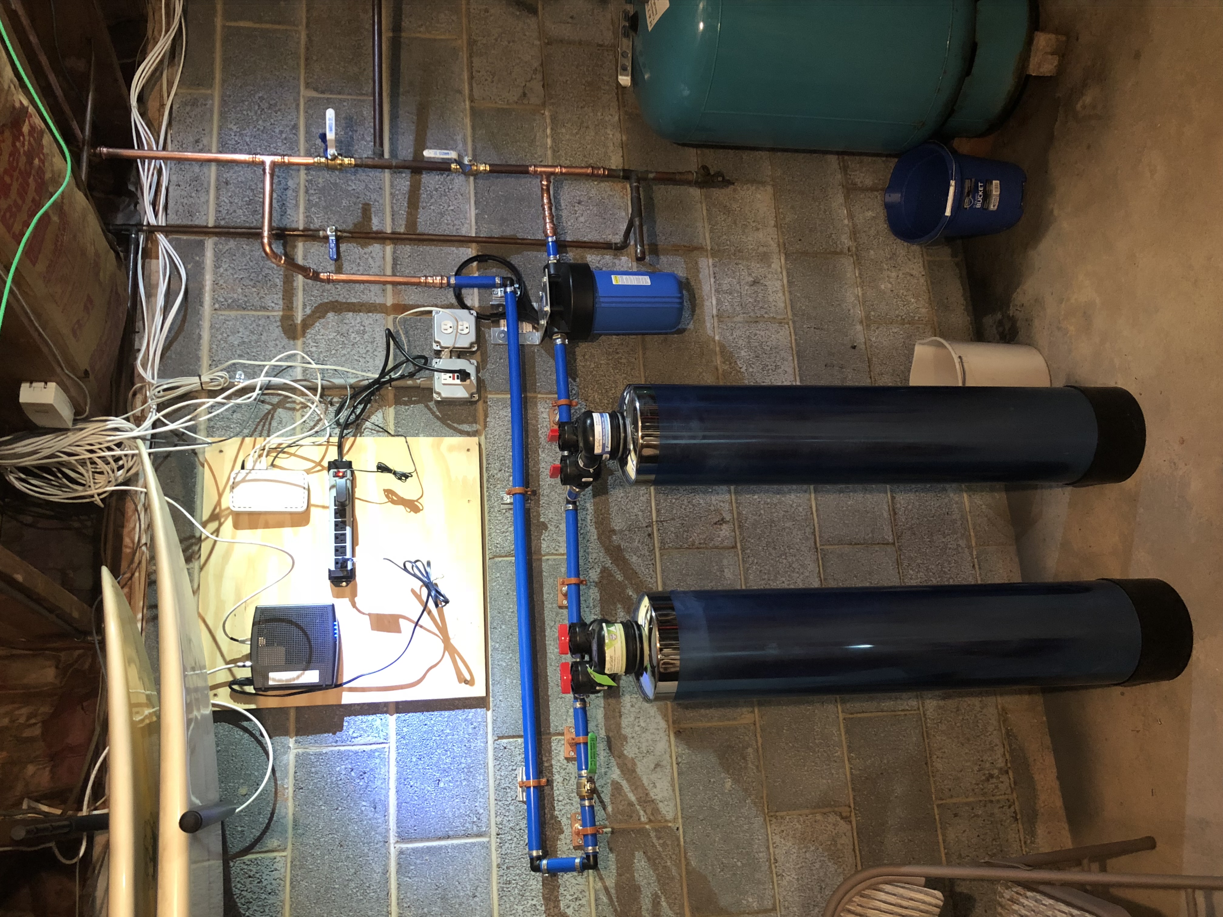 Well water treatment system with filters and pressure tank